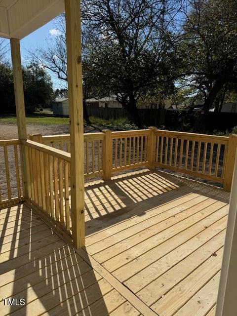 552 Rowan Road Clinton, NC 28328 - Photo 43 of 46 a view of balcony with wooden floor and fence