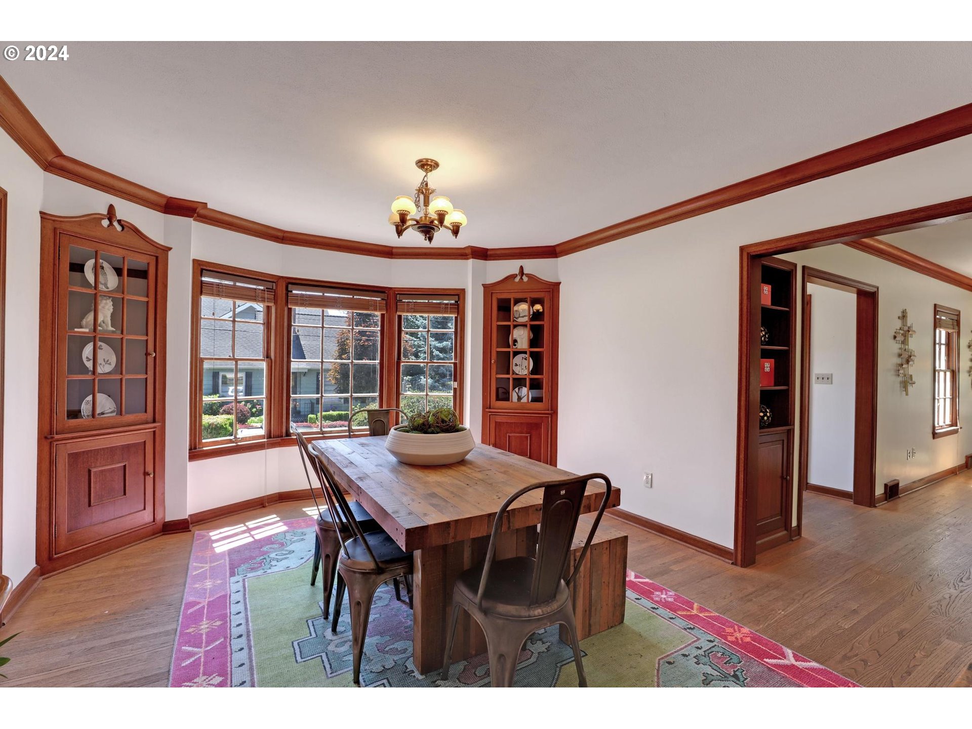 6003 Southeast Stephens Street Portland, OR 97215 - Photo 13 of 46 a view of a dining room with furniture wooden floor and chandelier