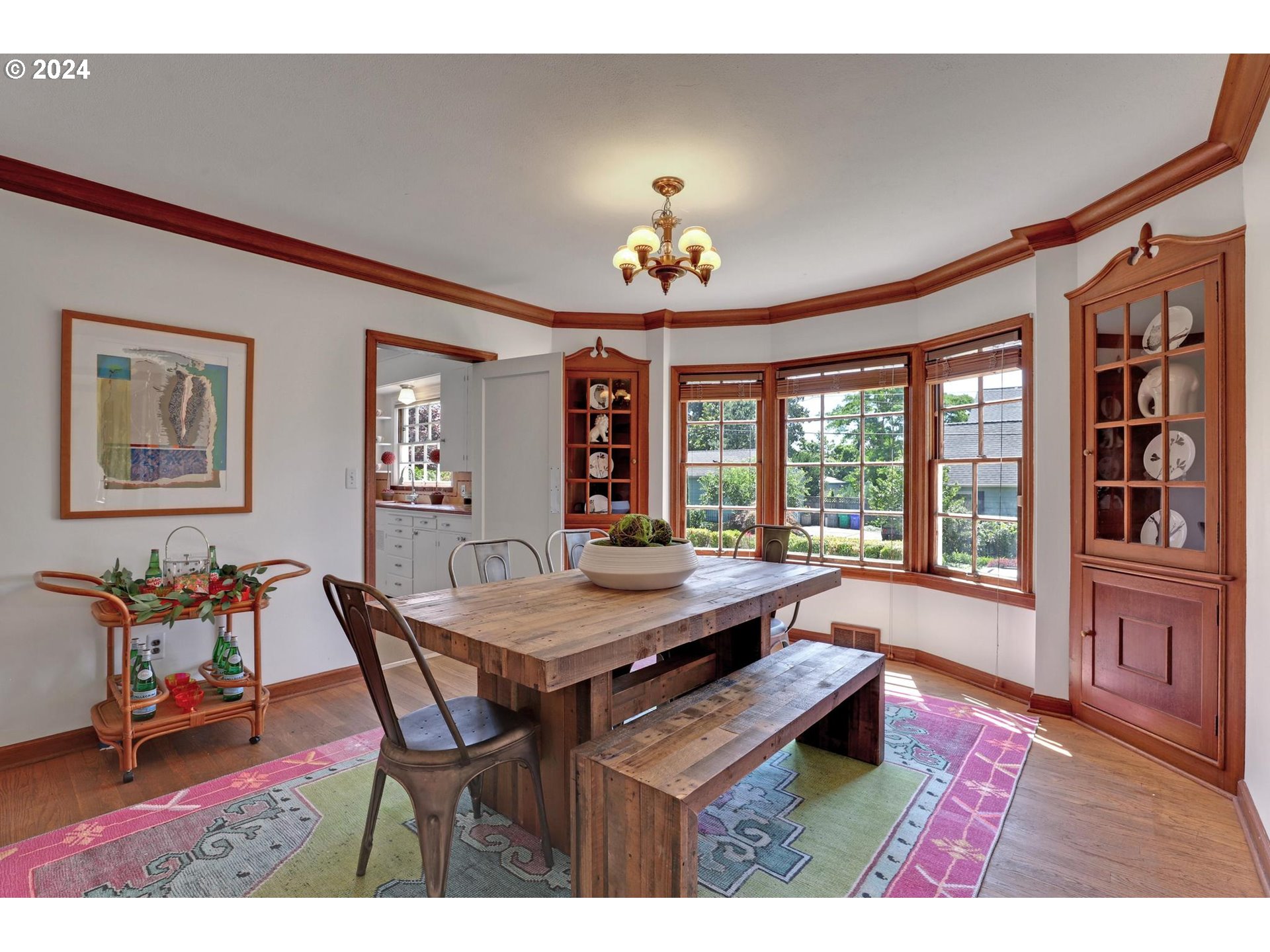 6003 Southeast Stephens Street Portland, OR 97215 - Photo 14 of 46 a view of a dining room with furniture window and wooden floor