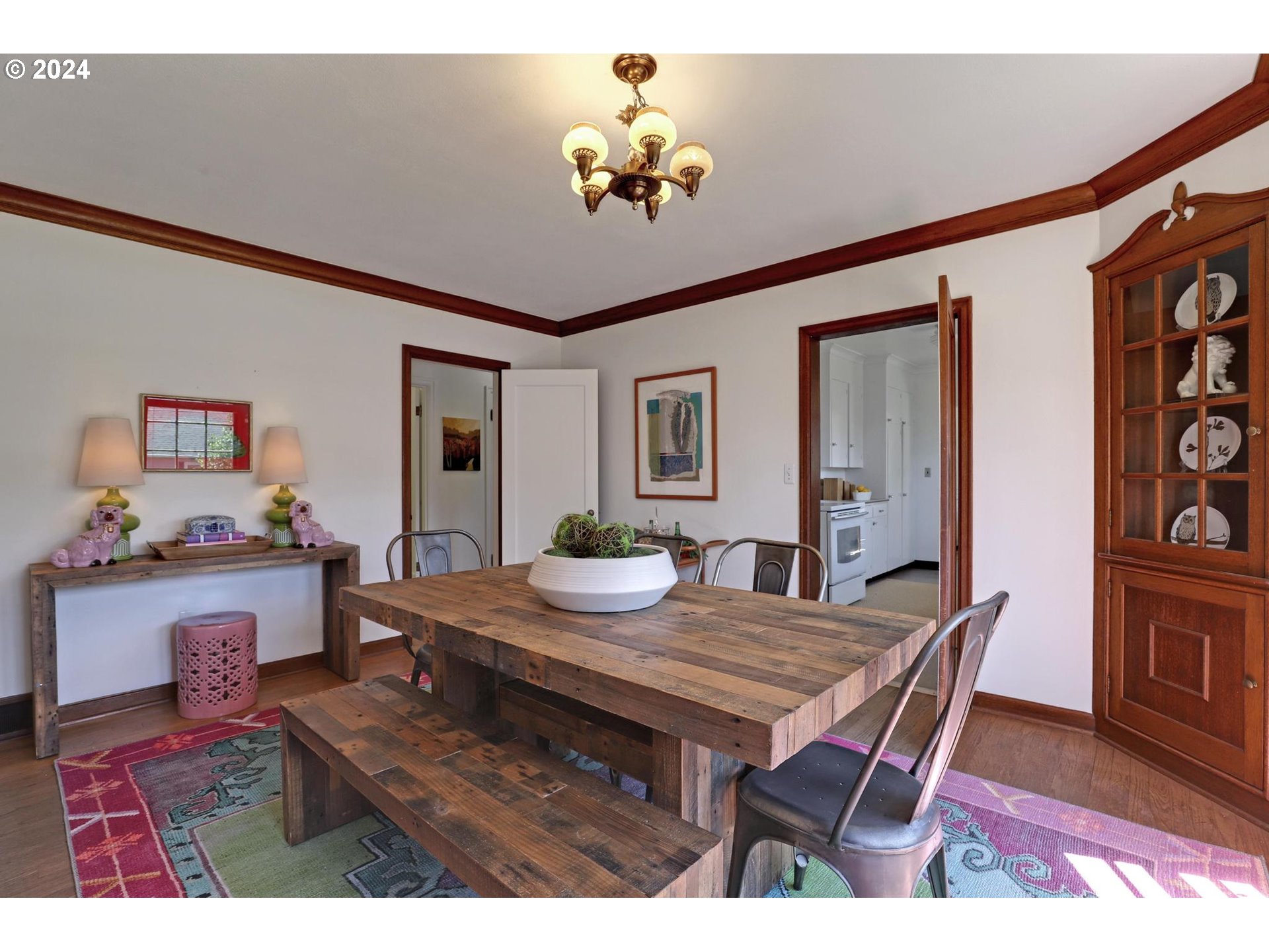 6003 Southeast Stephens Street Portland, OR 97215 - Photo 15 of 46 a view of a dining room with furniture and wooden floor