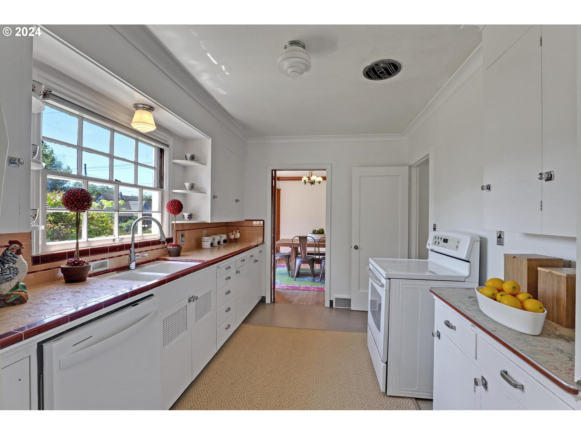 6003 Southeast Stephens Street Portland, OR 97215 - Photo 20 of 46 a kitchen with a sink and cabinets