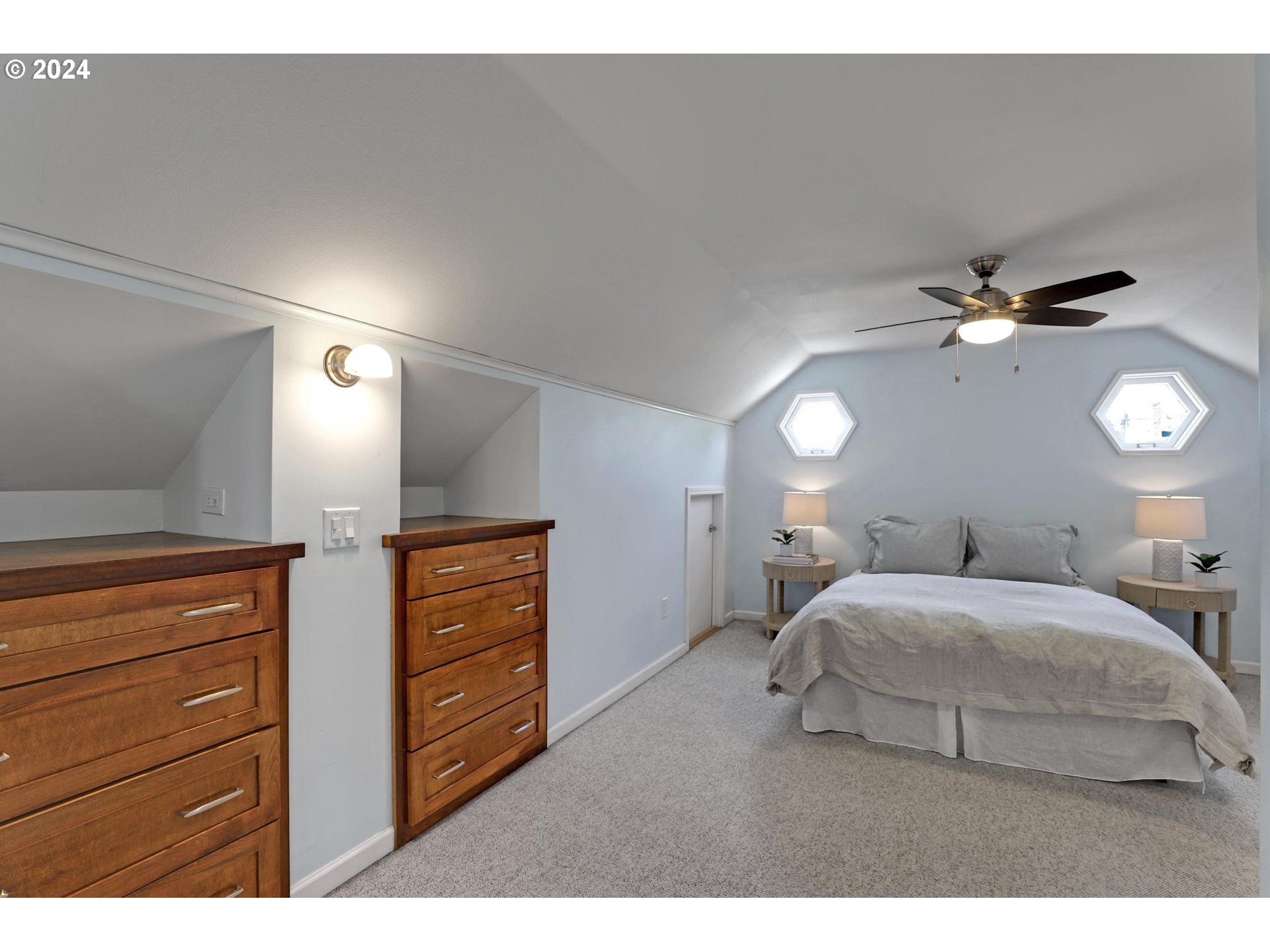 6003 Southeast Stephens Street Portland, OR 97215 - Photo 29 of 46 a bedroom with a bed and ceiling fan