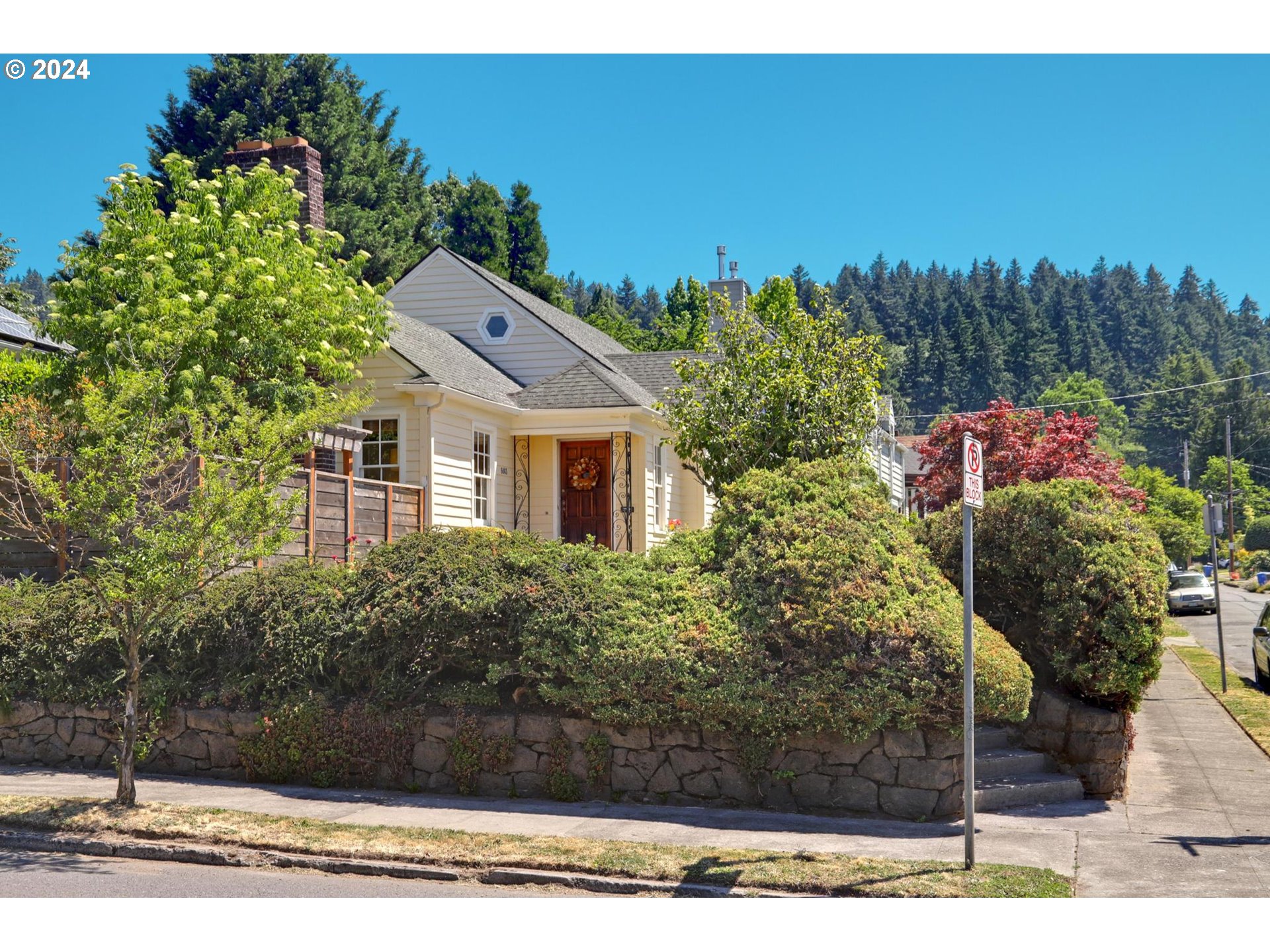 6003 Southeast Stephens Street Portland, OR 97215 - Photo 3 of 46 a front view of a house with a yard