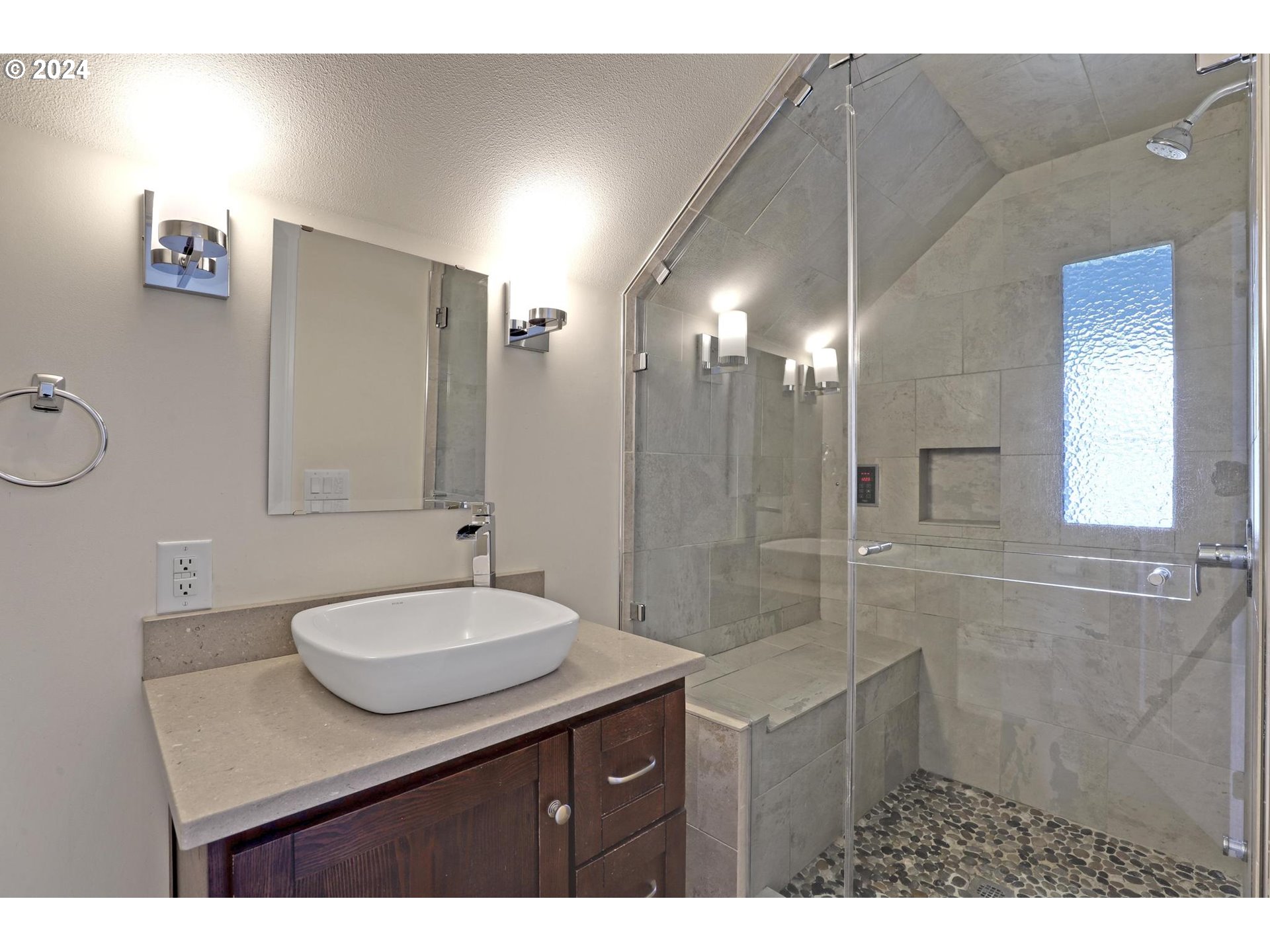 6003 Southeast Stephens Street Portland, OR 97215 - Photo 31 of 46 a bathroom with a sink mirror and a shower