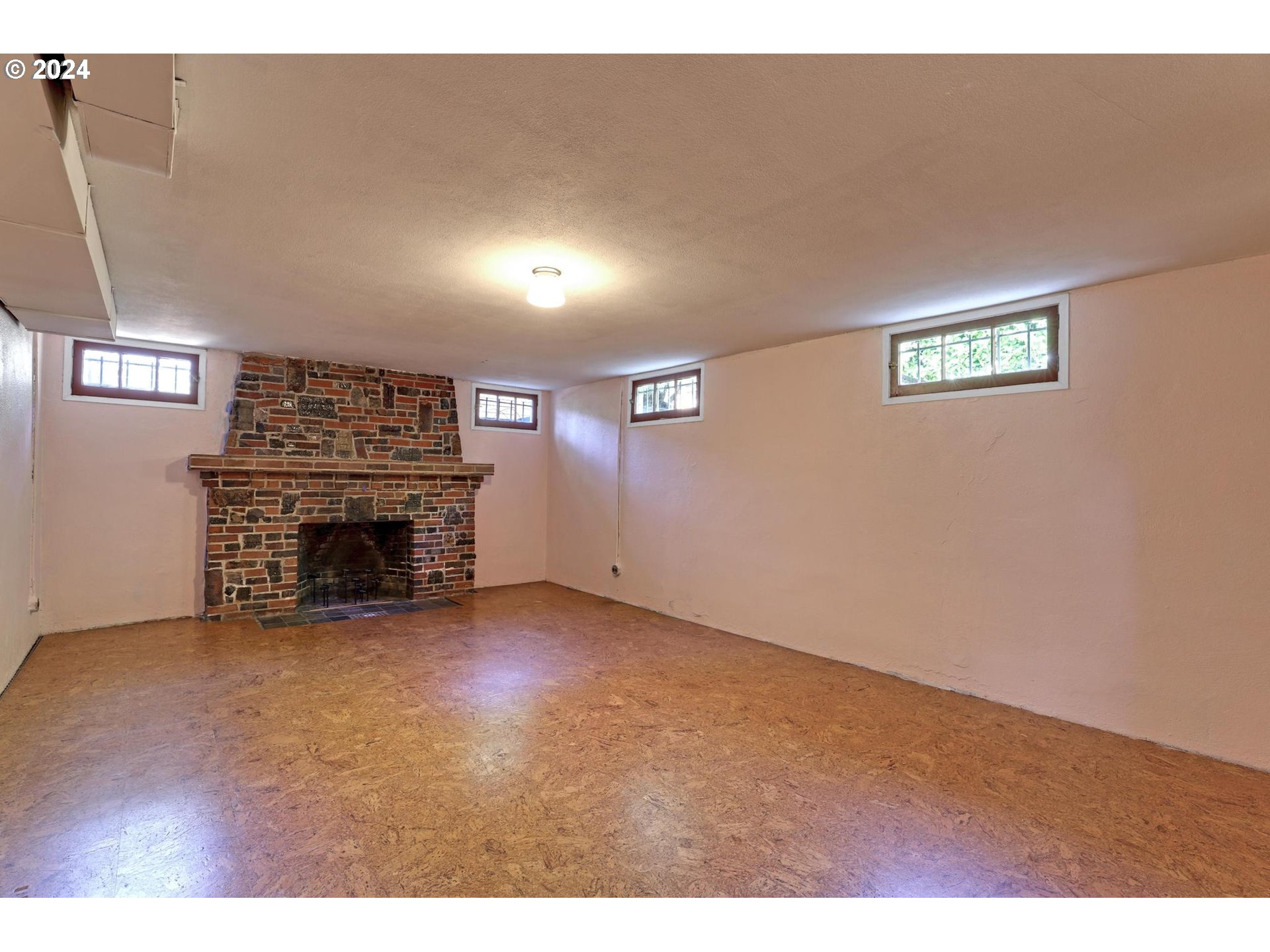 6003 Southeast Stephens Street Portland, OR 97215 - Photo 33 of 46 a view of an empty room with a fireplace