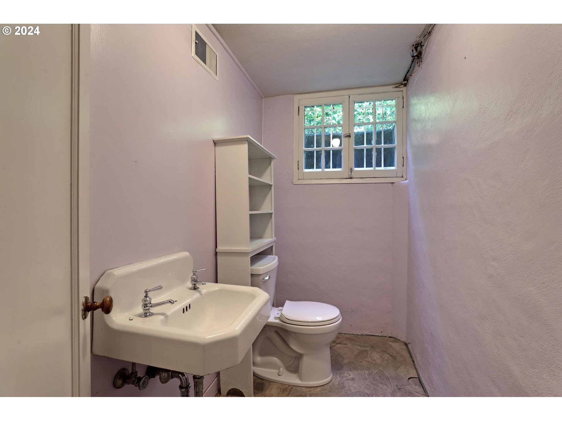 6003 Southeast Stephens Street Portland, OR 97215 - Photo 35 of 46 a bathroom with a sink toilet and mirror