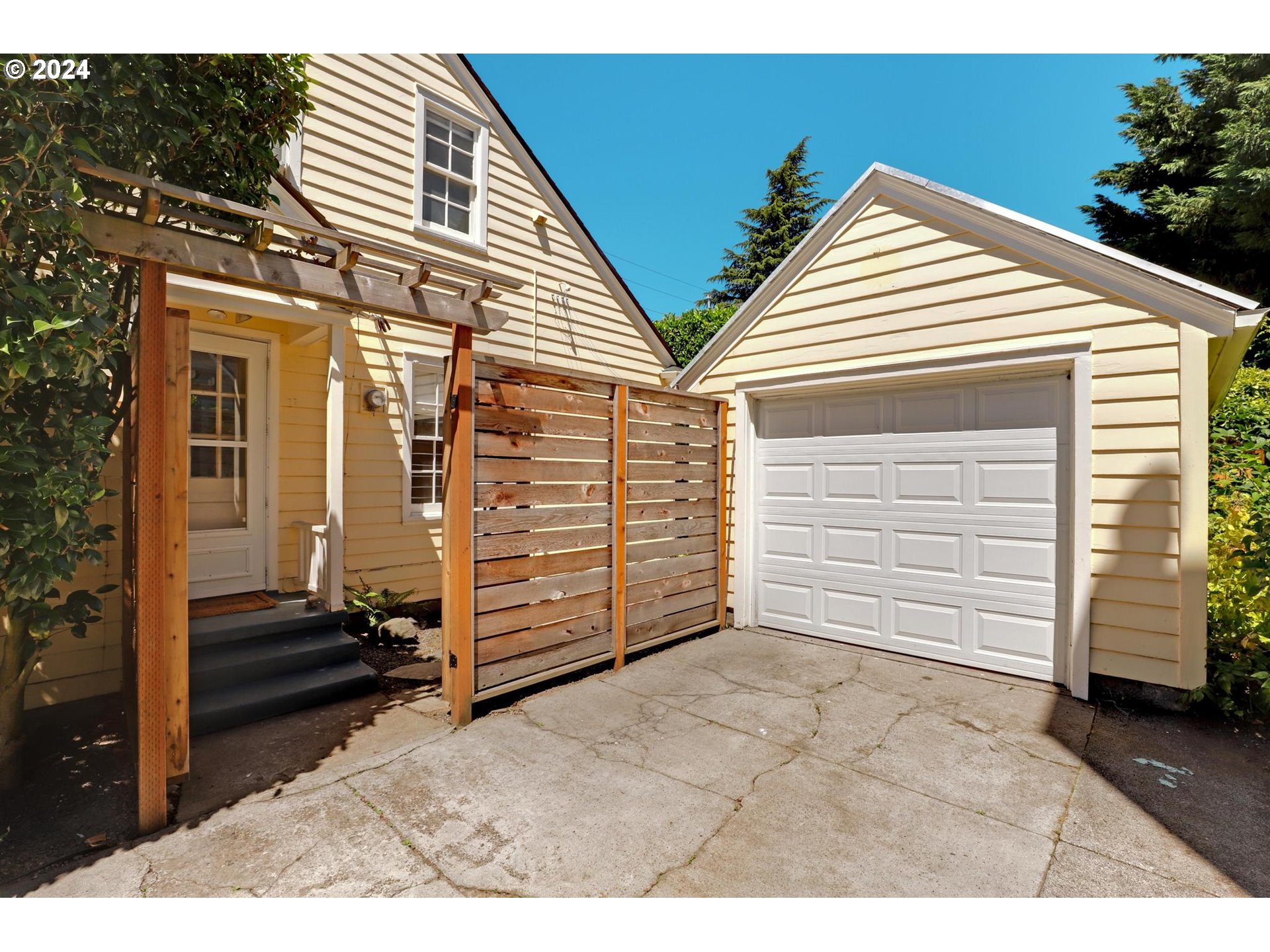 6003 Southeast Stephens Street Portland, OR 97215 - Photo 37 of 46 a view of a house with a backyard