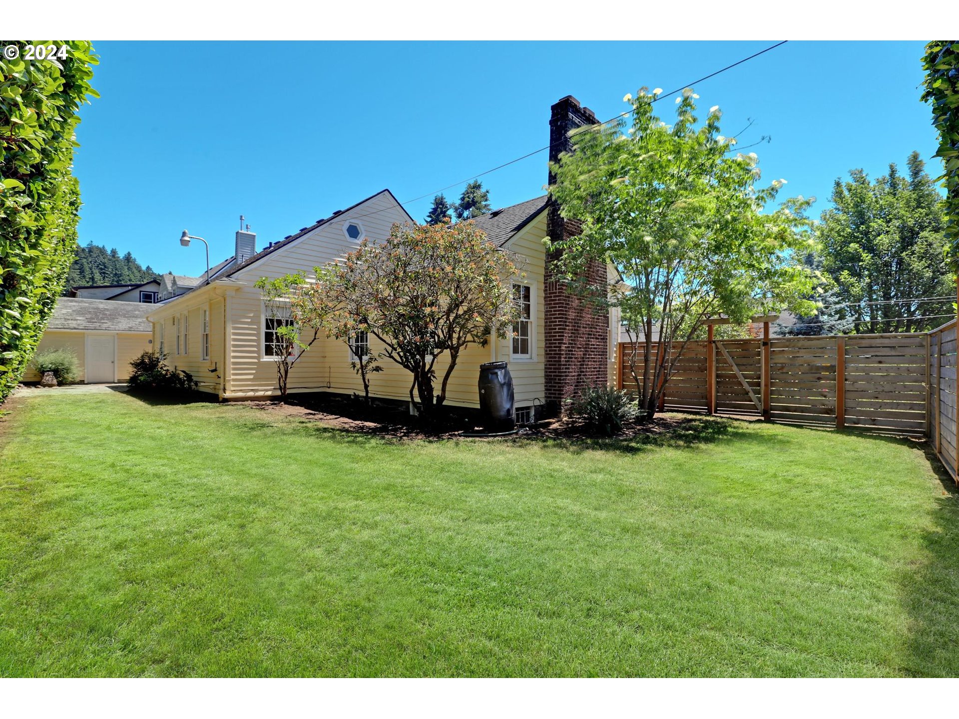 6003 Southeast Stephens Street Portland, OR 97215 - Photo 42 of 46 a front view of a house with garden