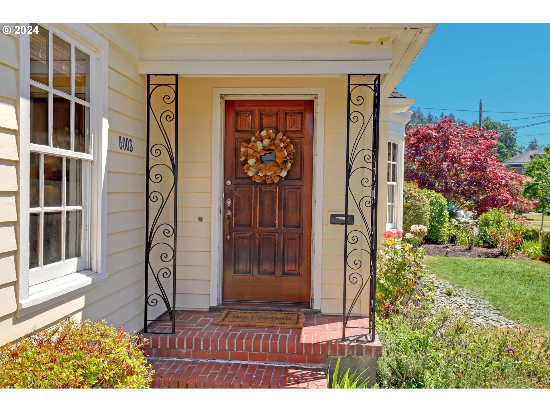 6003 Southeast Stephens Street Portland, OR 97215 - Photo 7 of 46 a front view of a house with a porch