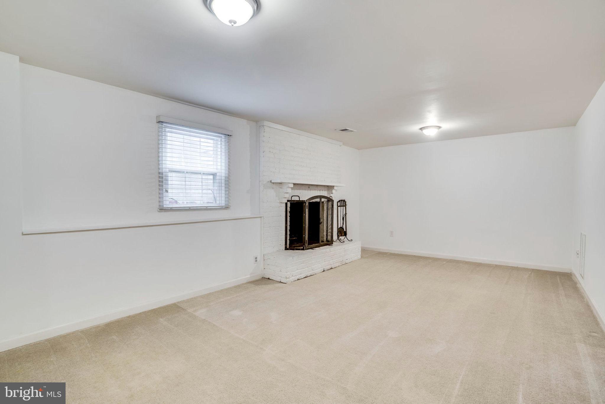 8453 Brainerd Court Springfield, VA 22153 - Photo 30 of 37 LL Family Room with wood burning fireplace