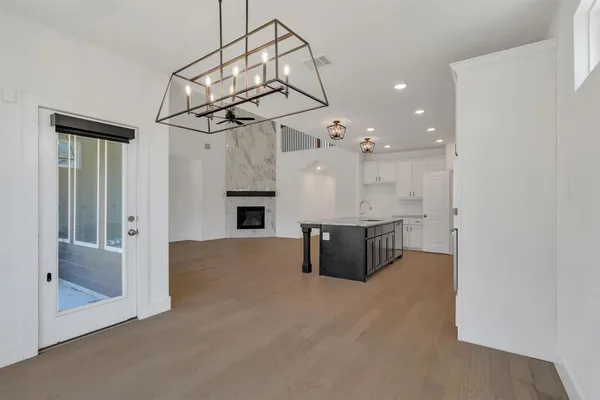 a view of a livingroom with furniture and chandelier