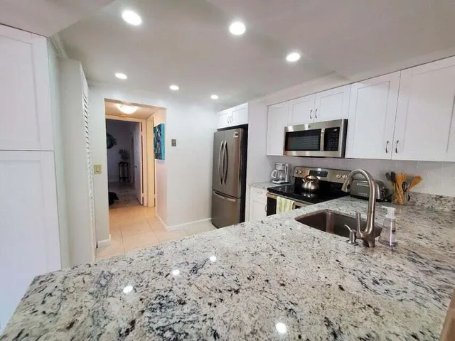 a kitchen with a microwave and a stove