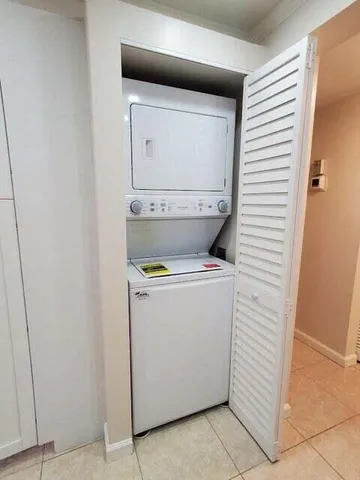 a bathroom with a toilet sink vanity and mirror