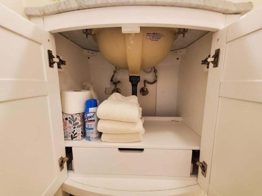 1605 Highway 1, Unit F203 Jupiter, FL 33477 - Photo 24 of 39 a bathroom with a toilet