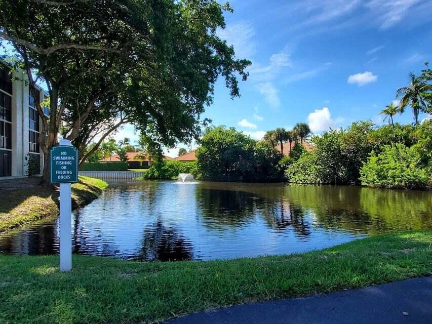 1605 Highway 1, Unit F203 Jupiter, FL 33477 - Photo 36 of 39 a view of a lake with houses