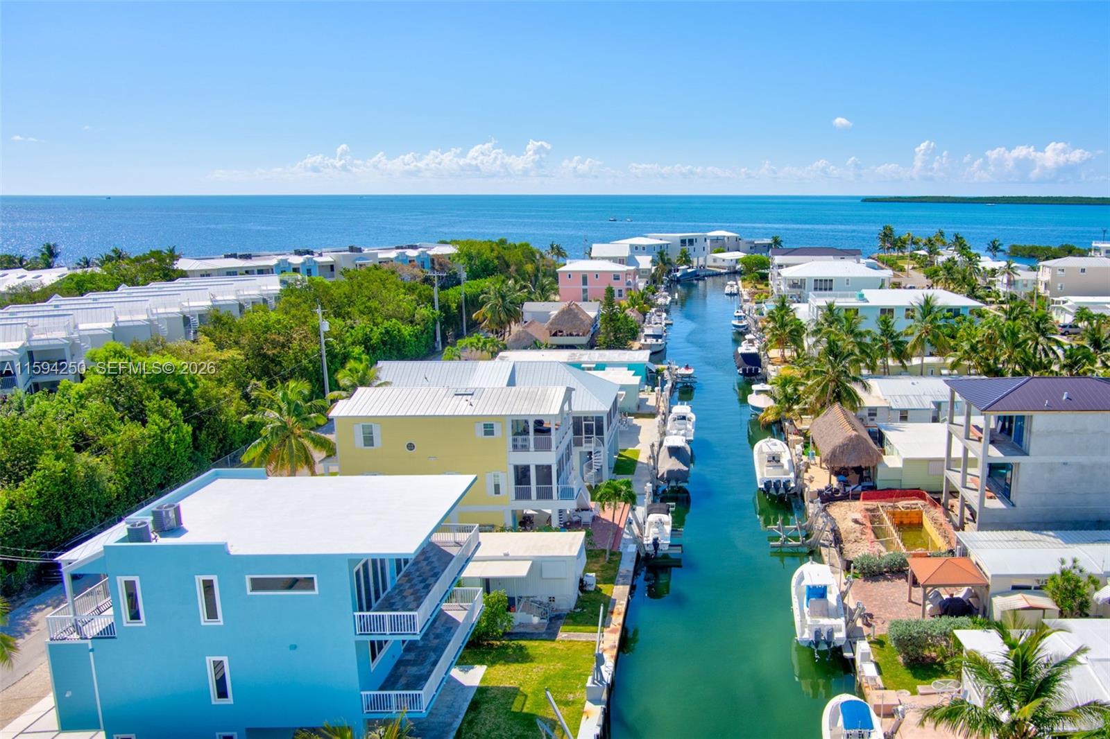 84 Coral Way Key Largo, FL 33037 - Photo 47 of 55 an aerial view of a house with an outdoor space and seating