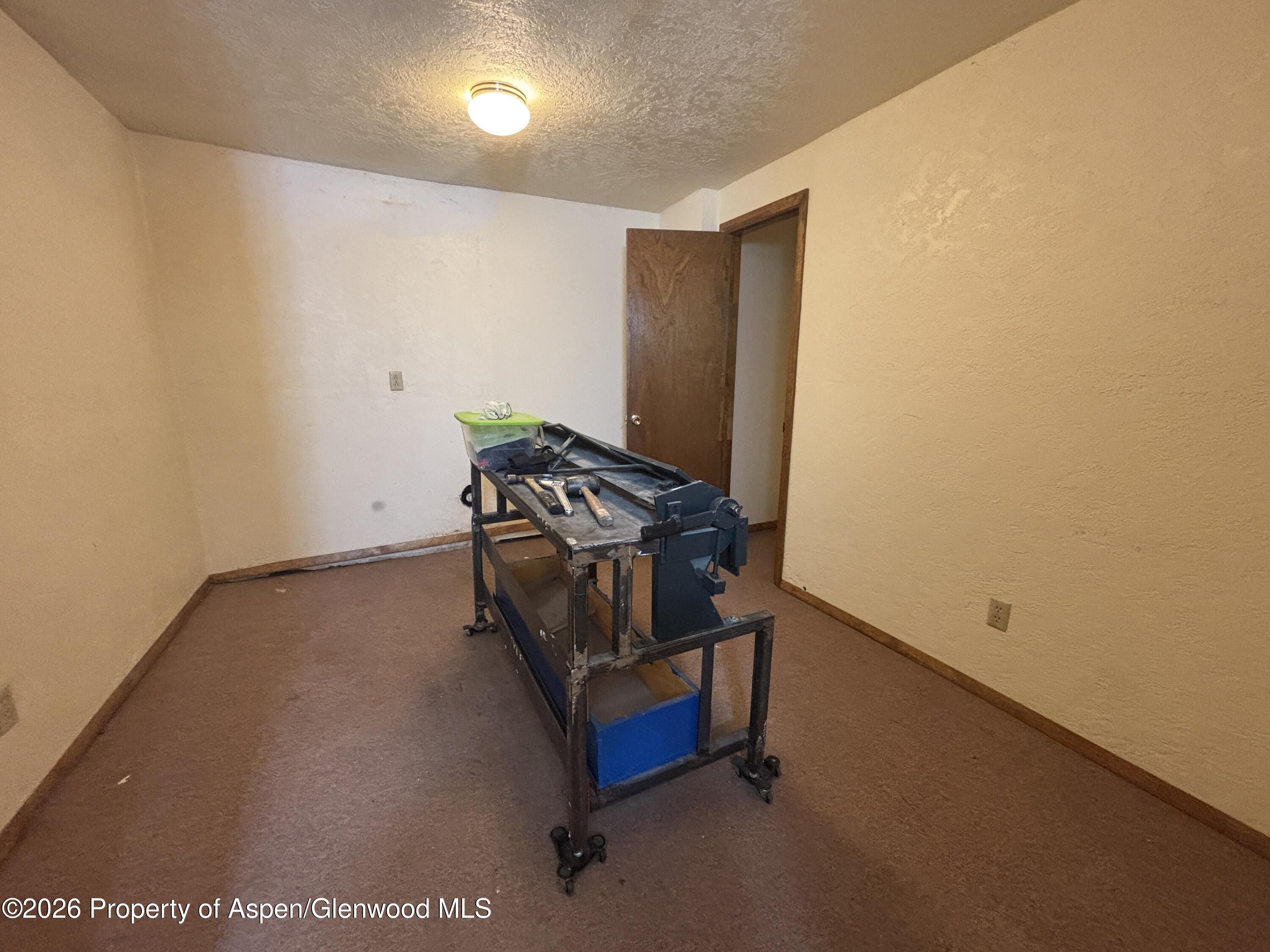 1623 West 7th Street Rifle, CO 81650 - Photo 12 of 21 a room with storage and utility