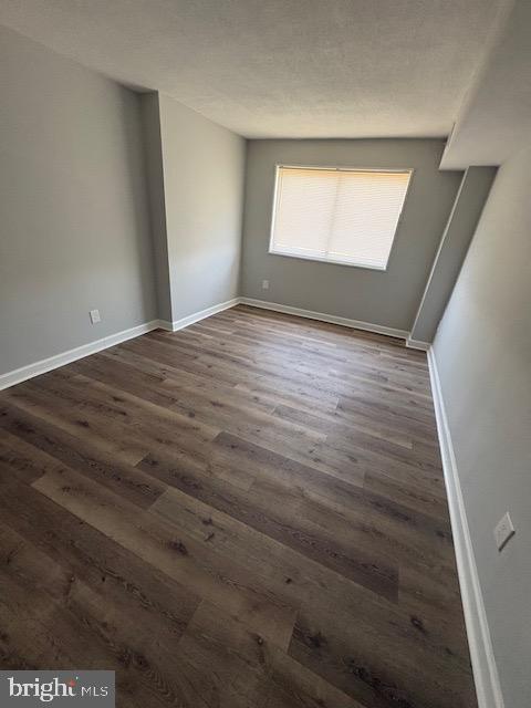 1836 Metzerott Road, Unit 704 Hyattsville, MD 20783 - Photo 13 of 33 an empty room with wooden floor and windows