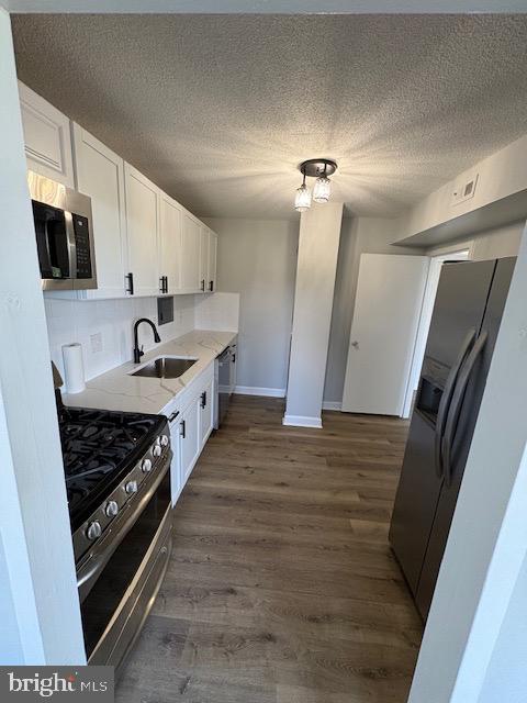 1836 Metzerott Road, Unit 704 Hyattsville, MD 20783 - Photo 2 of 33 a kitchen with stainless steel appliances a stove a sink and a refrigerator