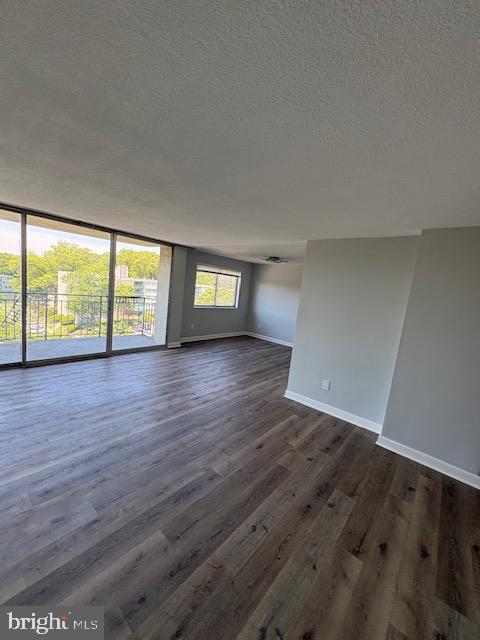 1836 Metzerott Road, Unit 704 Hyattsville, MD 20783 - Photo 22 of 33 an empty room with wooden floor and windows