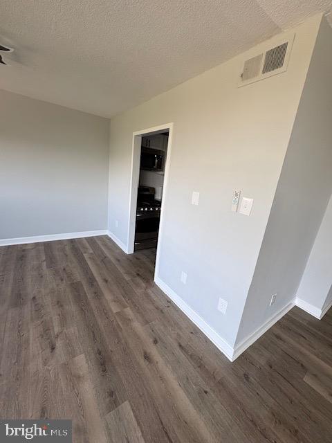 1836 Metzerott Road, Unit 704 Hyattsville, MD 20783 - Photo 23 of 33 a view of an empty room with wooden floor