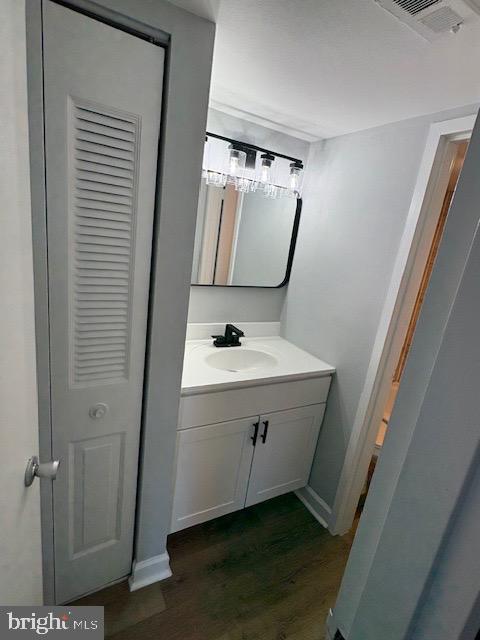 1836 Metzerott Road, Unit 704 Hyattsville, MD 20783 - Photo 4 of 33 a bathroom with a sink mirror and toilet