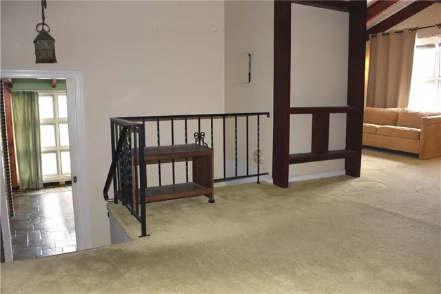 a view of staircase and living room