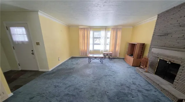 a view of livingroom with hardwood floor and a fireplace