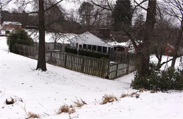 a view of a backyard of the house