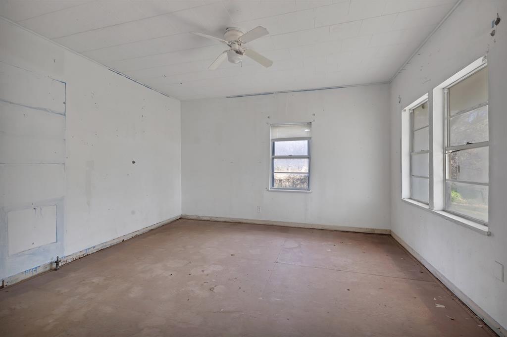 202 Johns Road Chico, TX 76431 - Photo 30 of 33 a view of an empty room with a window