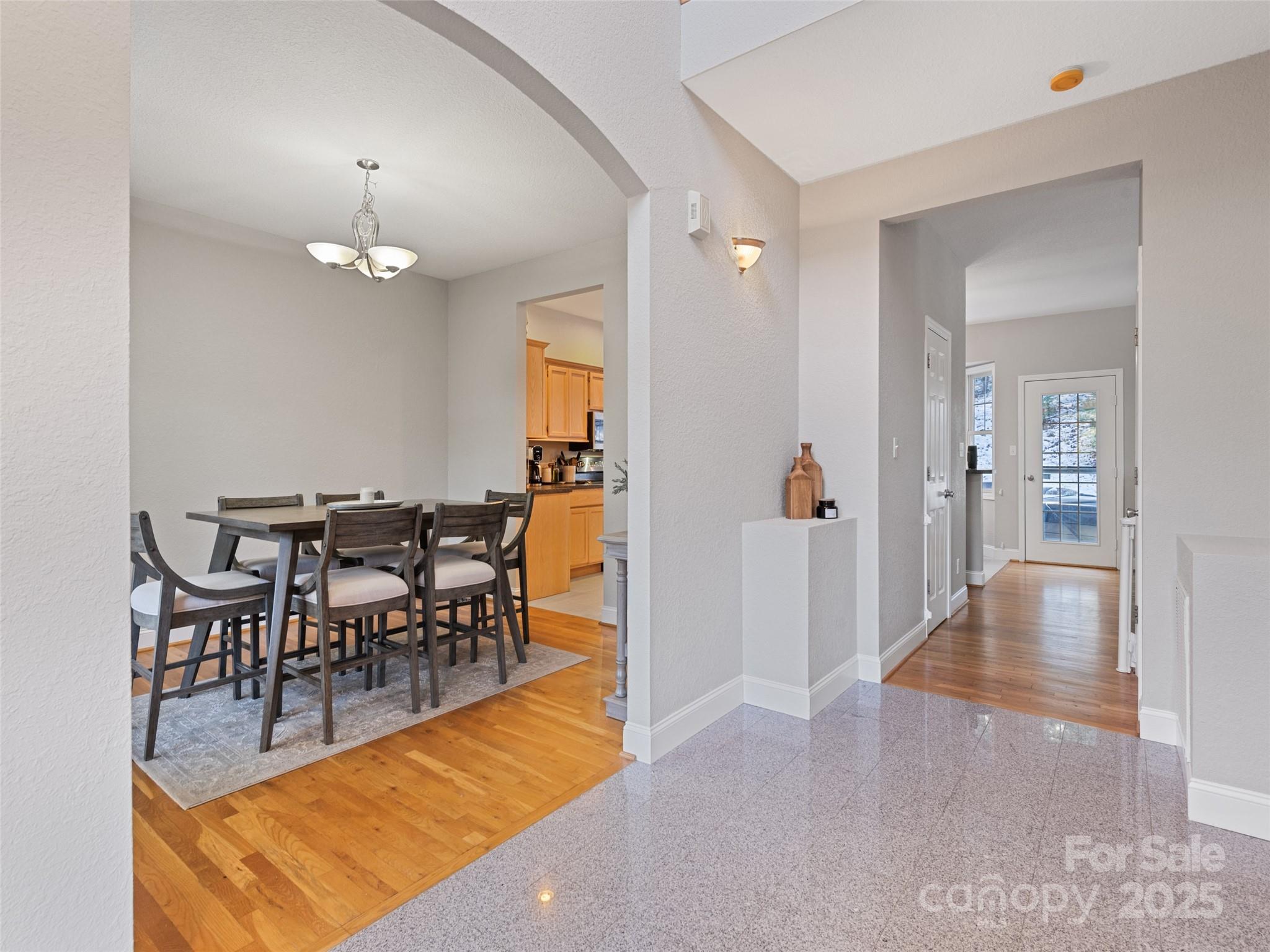 15 Lone Coyote Ridge Fletcher, NC 28732 - Photo 20 of 46 a view of a dining room with furniture and wooden floor