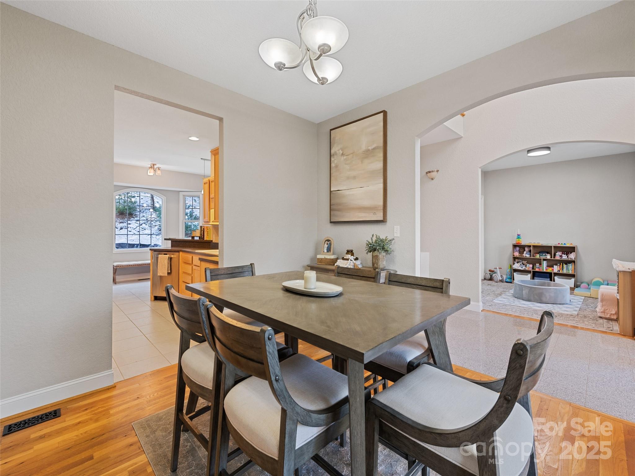 15 Lone Coyote Ridge Fletcher, NC 28732 - Photo 21 of 46 a view of a dining room with furniture and wooden floor