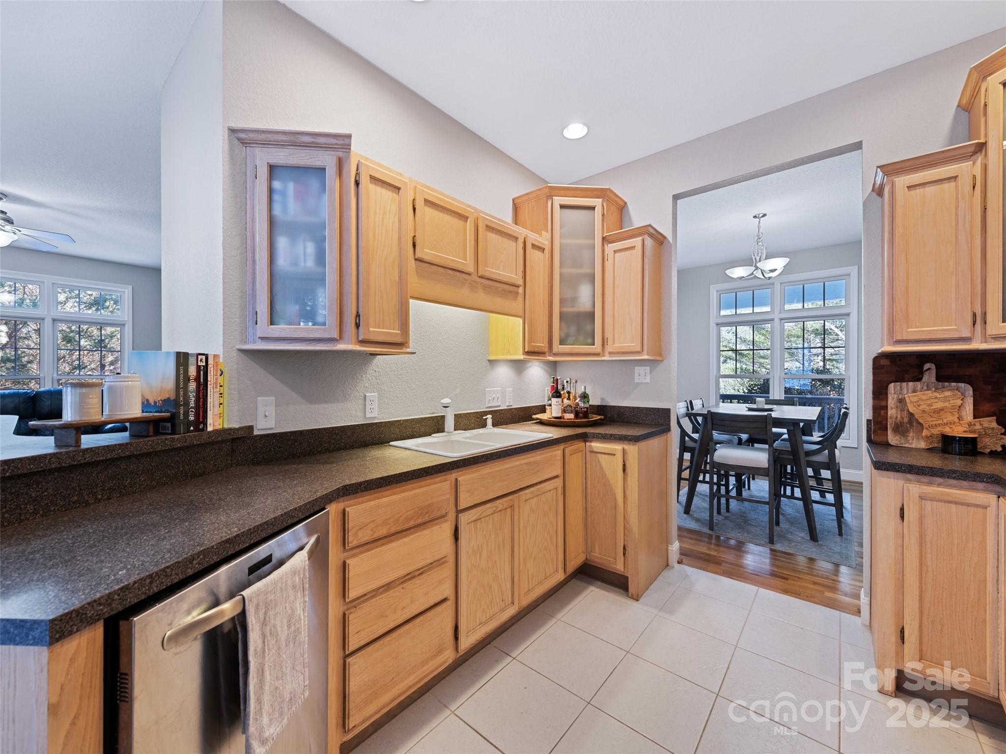 15 Lone Coyote Ridge Fletcher, NC 28732 - Photo 26 of 46 a kitchen with stainless steel appliances granite countertop sink stove top oven and cabinets