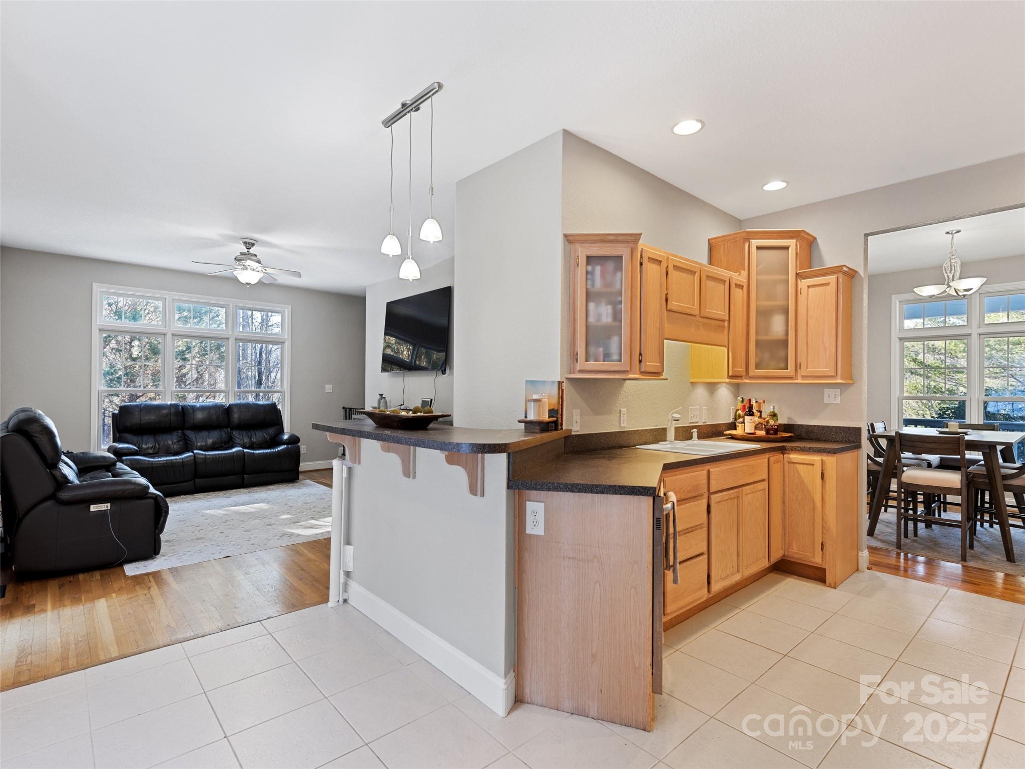 15 Lone Coyote Ridge Fletcher, NC 28732 - Photo 27 of 46 a large kitchen with kitchen island a sink a counter space and stainless steel appliances