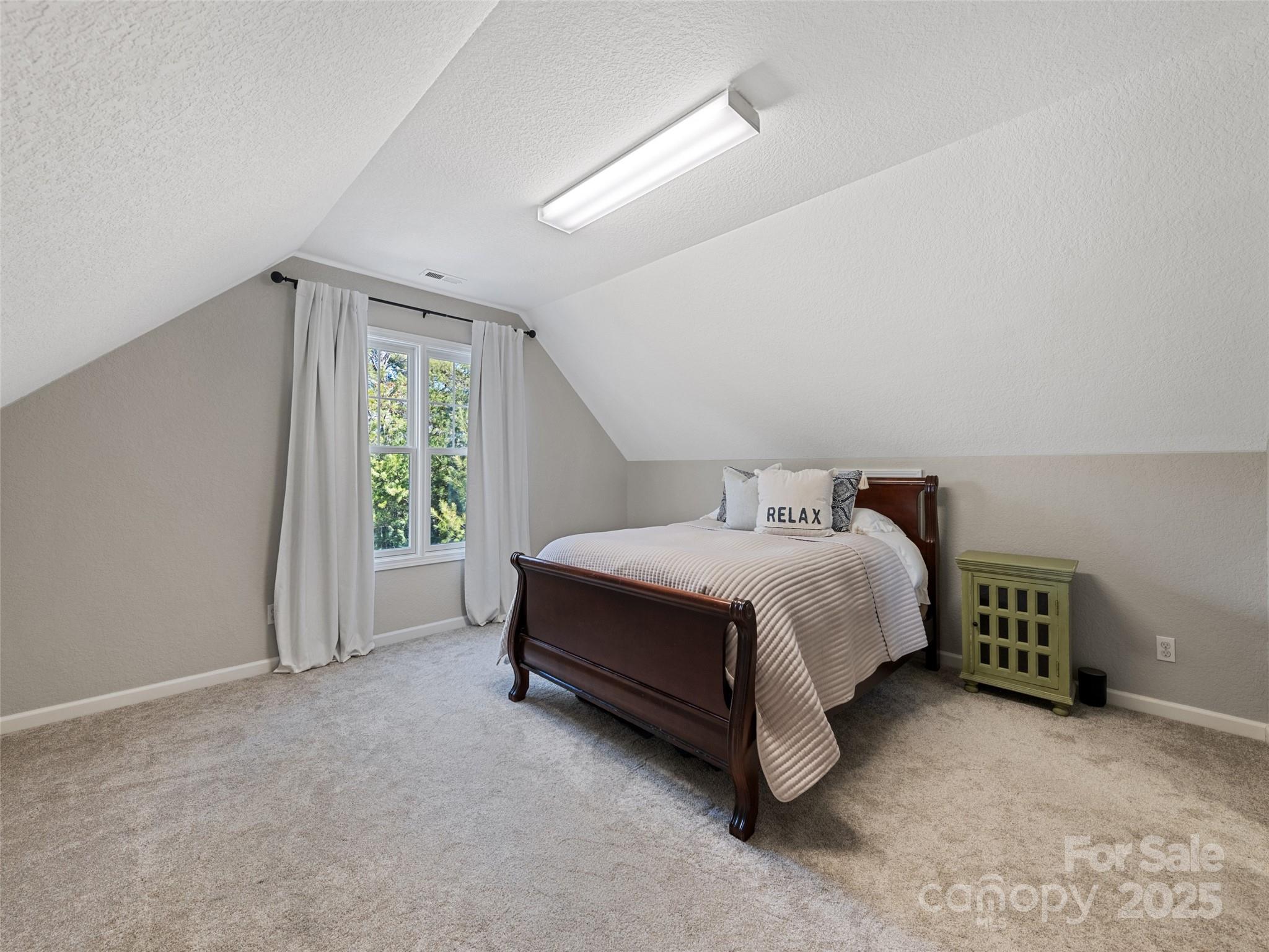 15 Lone Coyote Ridge Fletcher, NC 28732 - Photo 40 of 46 a spacious bedroom with a bed and a window