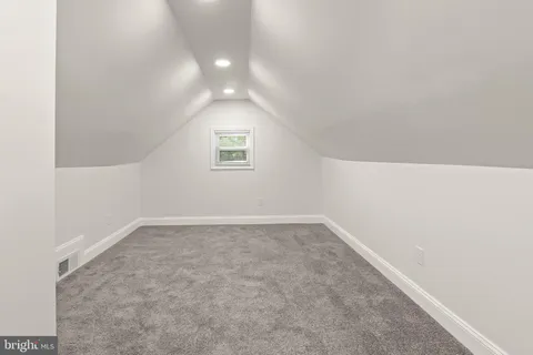 an empty room with a empty space and window