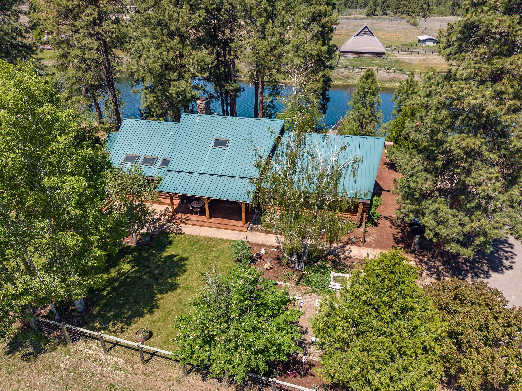 32907 River Bend Road Chiloquin, OR 97624 - Photo 65 of 83 an aerial view of a house with a yard and large trees