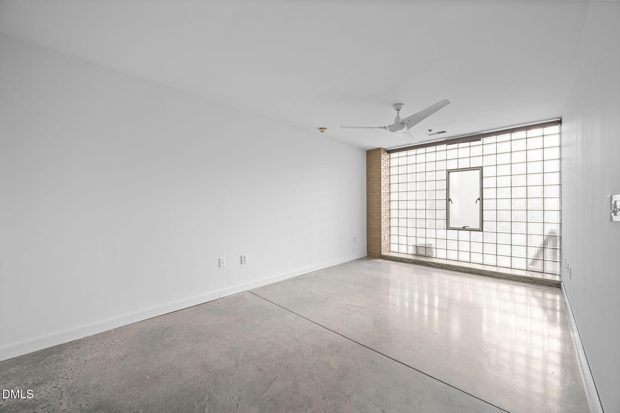 319 Fayetteville Street, Unit 210 Raleigh, NC 27601 - Photo 23 of 61 a view of an empty room with a window
