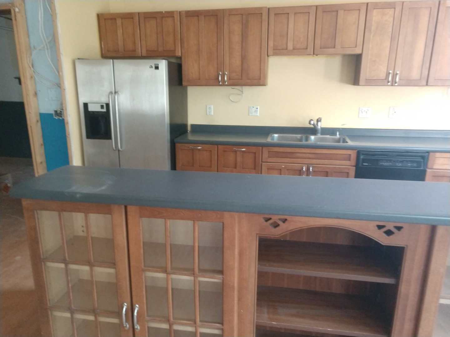 350 County Line Road Lee, IL 60530 - Photo 7 of 31 a kitchen with cabinets a refrigerator and a sink