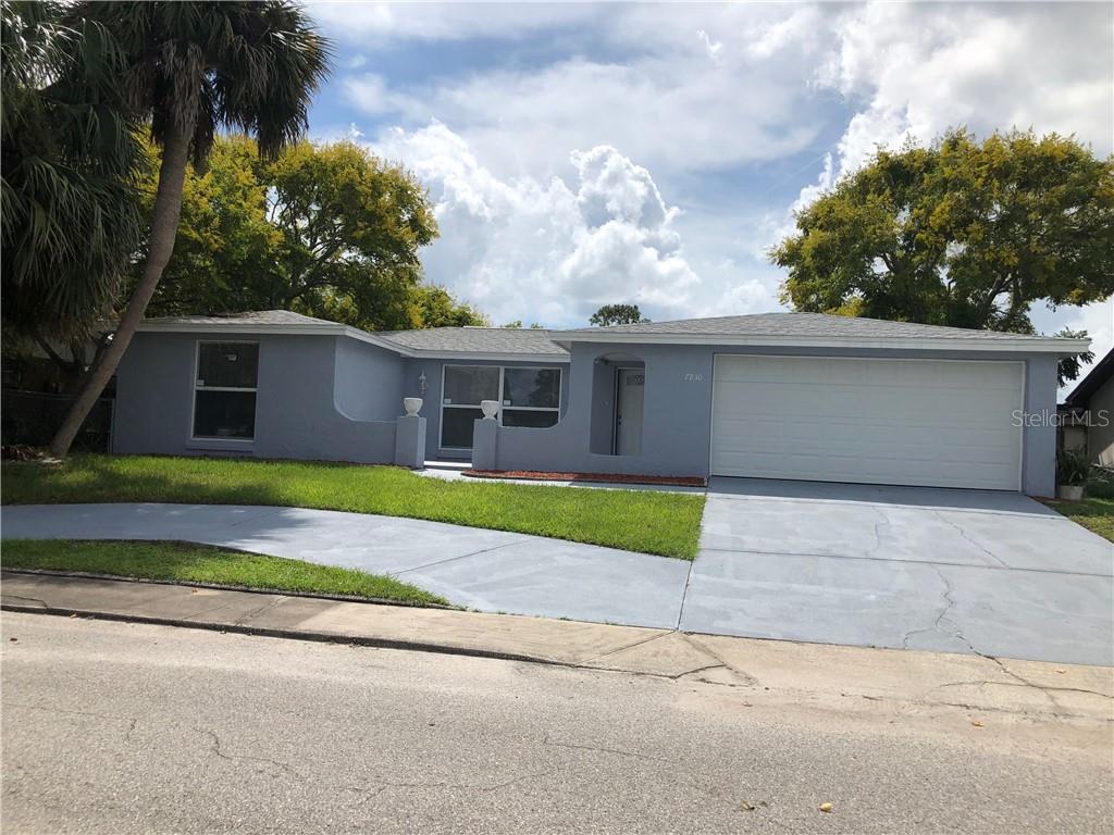7830 Prairie Drive Port Richey, FL 34668 - Photo 1 of 1 FRONT OF THE HOUSE