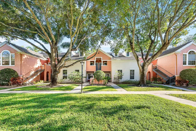a house view with swimming pool and garden