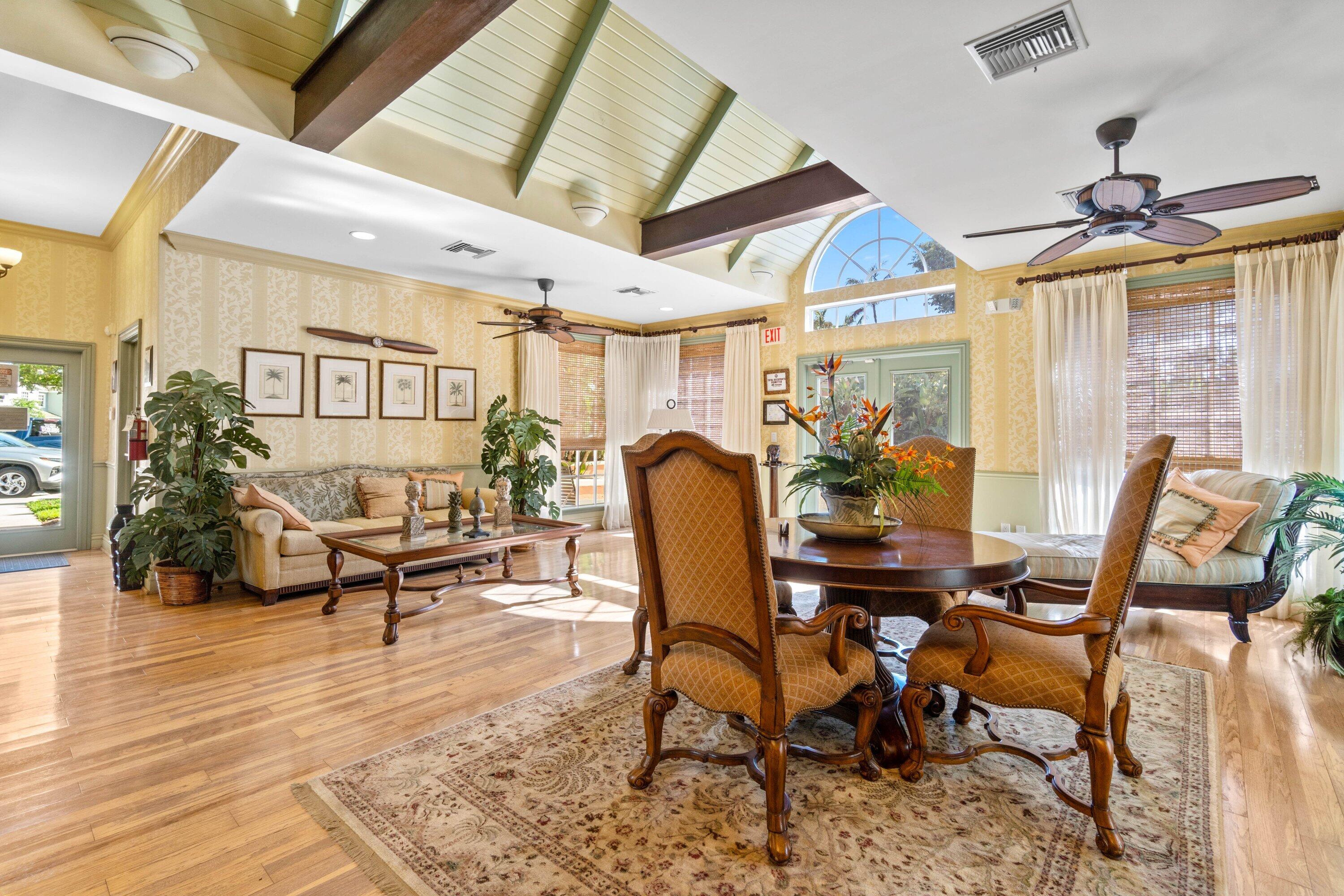 1001 Crystal Way, Unit M Delray Beach, FL 33444 - Photo 39 of 42 a view of a dining room with furniture window and wooden floor