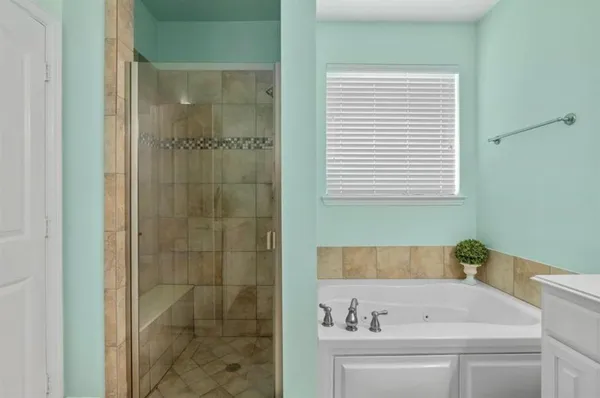 a view of an empty room with a bathroom