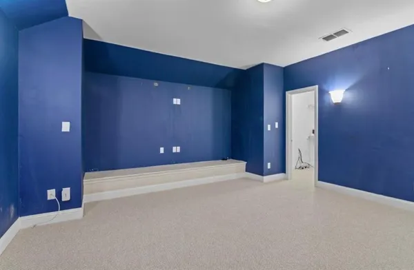 a bathroom with a sink a toilet a mirror and shower