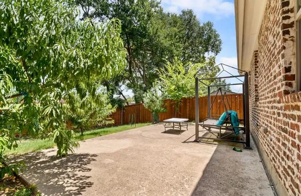 a view of a balcony with wooden floor and stairs