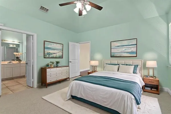 a living room with furniture fireplace and a window