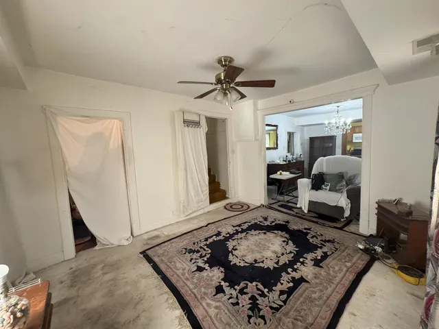 a living room with a couch and a rug