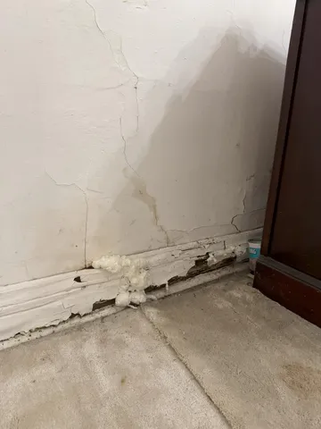 a kitchen with a stove a sink and a window