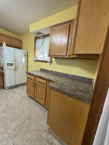 a view of a storage and utility room in a kitchen