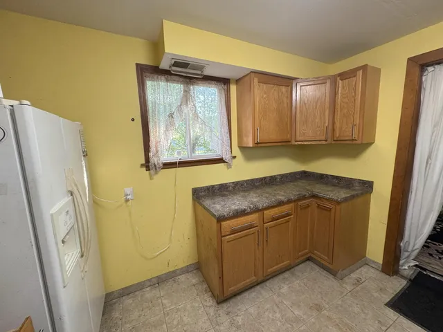 a bedroom with a bed and a mirror